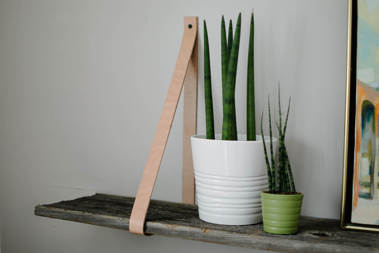 Simple DIY shelf with reclaimed wood and leather straps