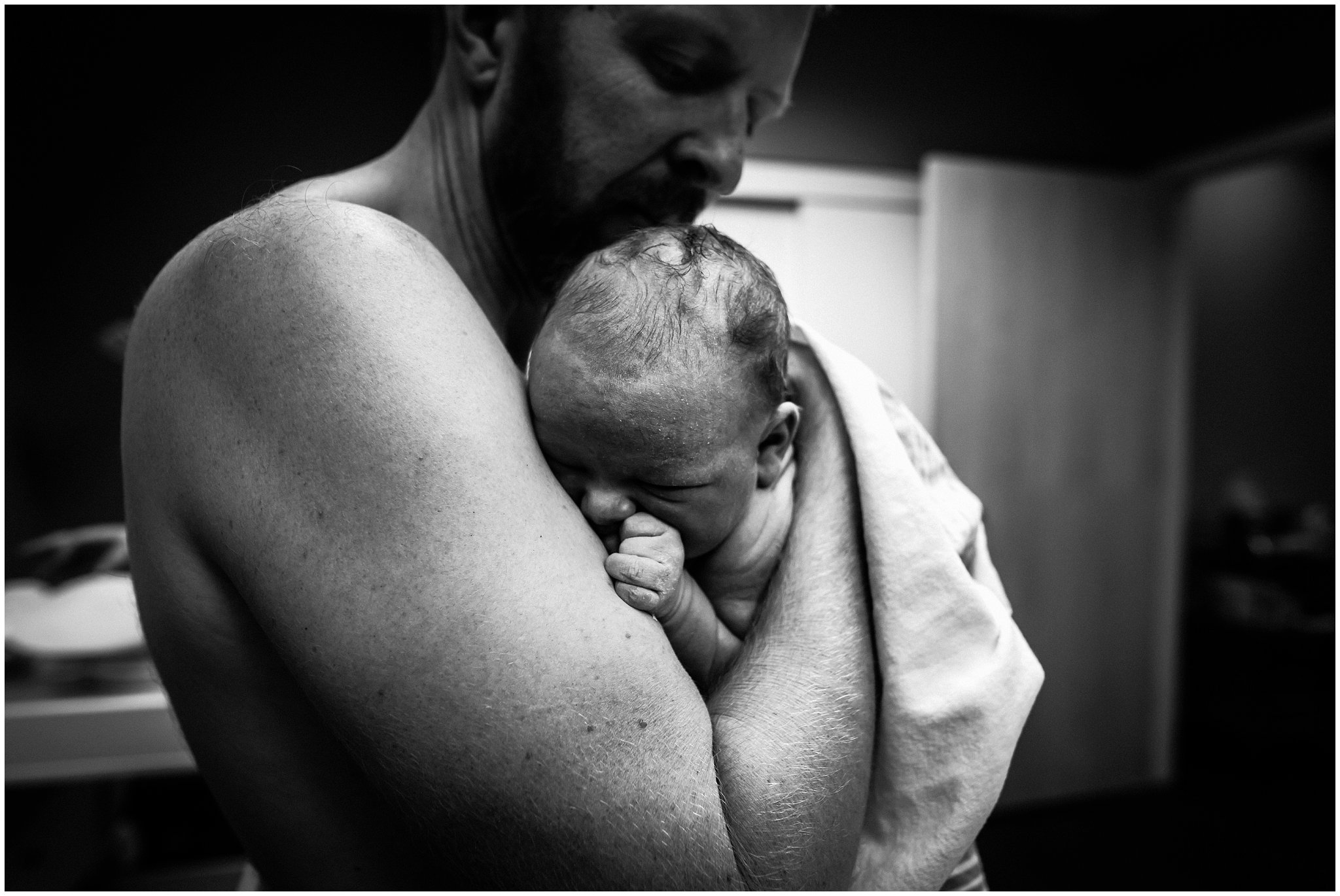 Birth photographer captures moment dad holds son for first time