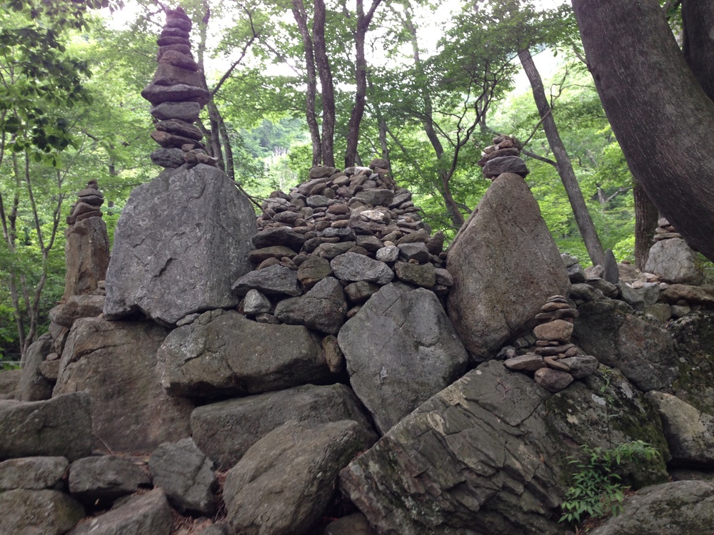 The top of Jirisan.  Rewards are these rocks and a natural spring to help you hydrate before turning around and walking back down.