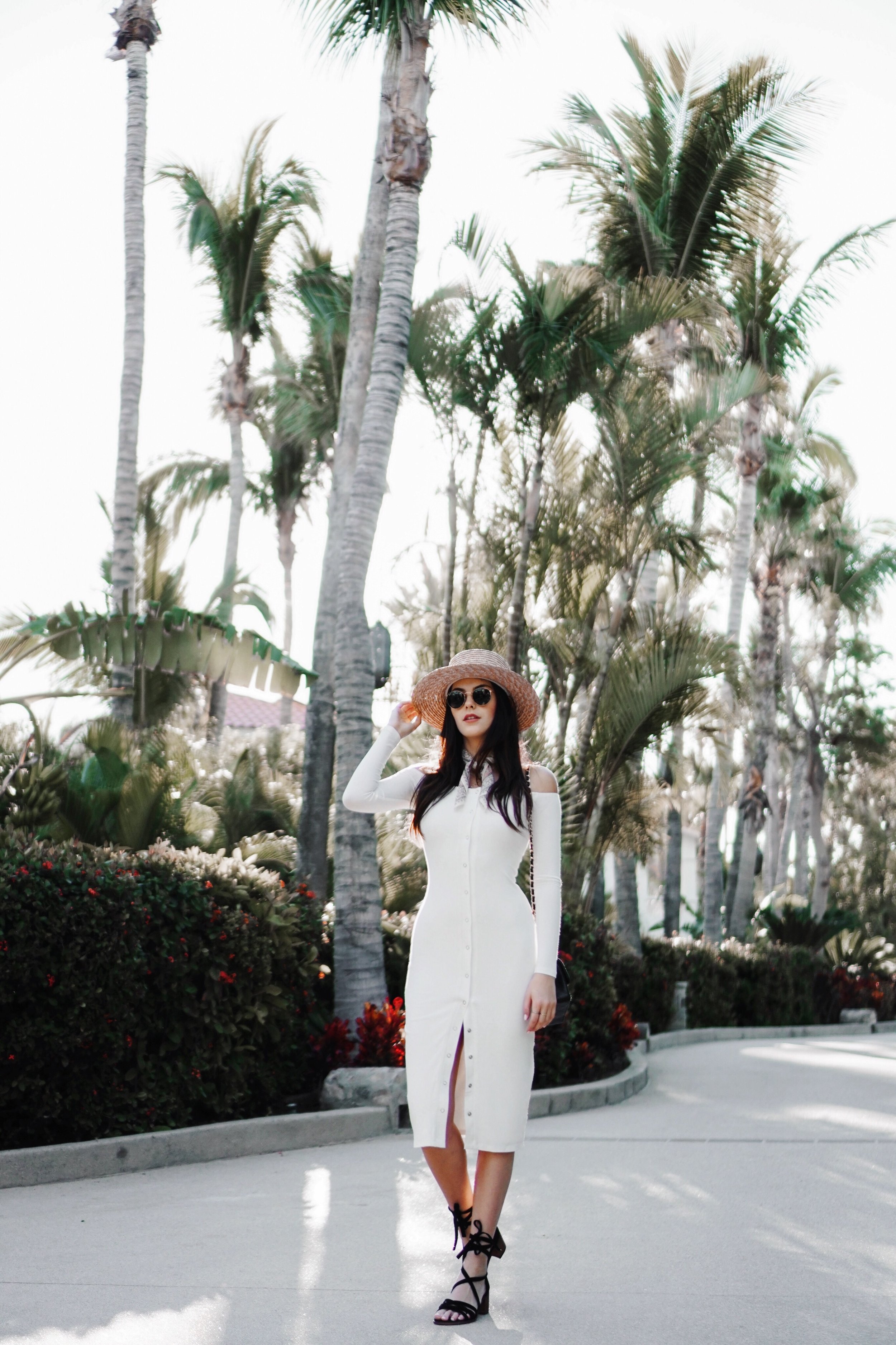 Julia Friedman wearing a Privacy Please dress from Revolve Clothing, Steve Madden shoes, and a Lack of Color hat at The One and Only Palmilla in Cabo.