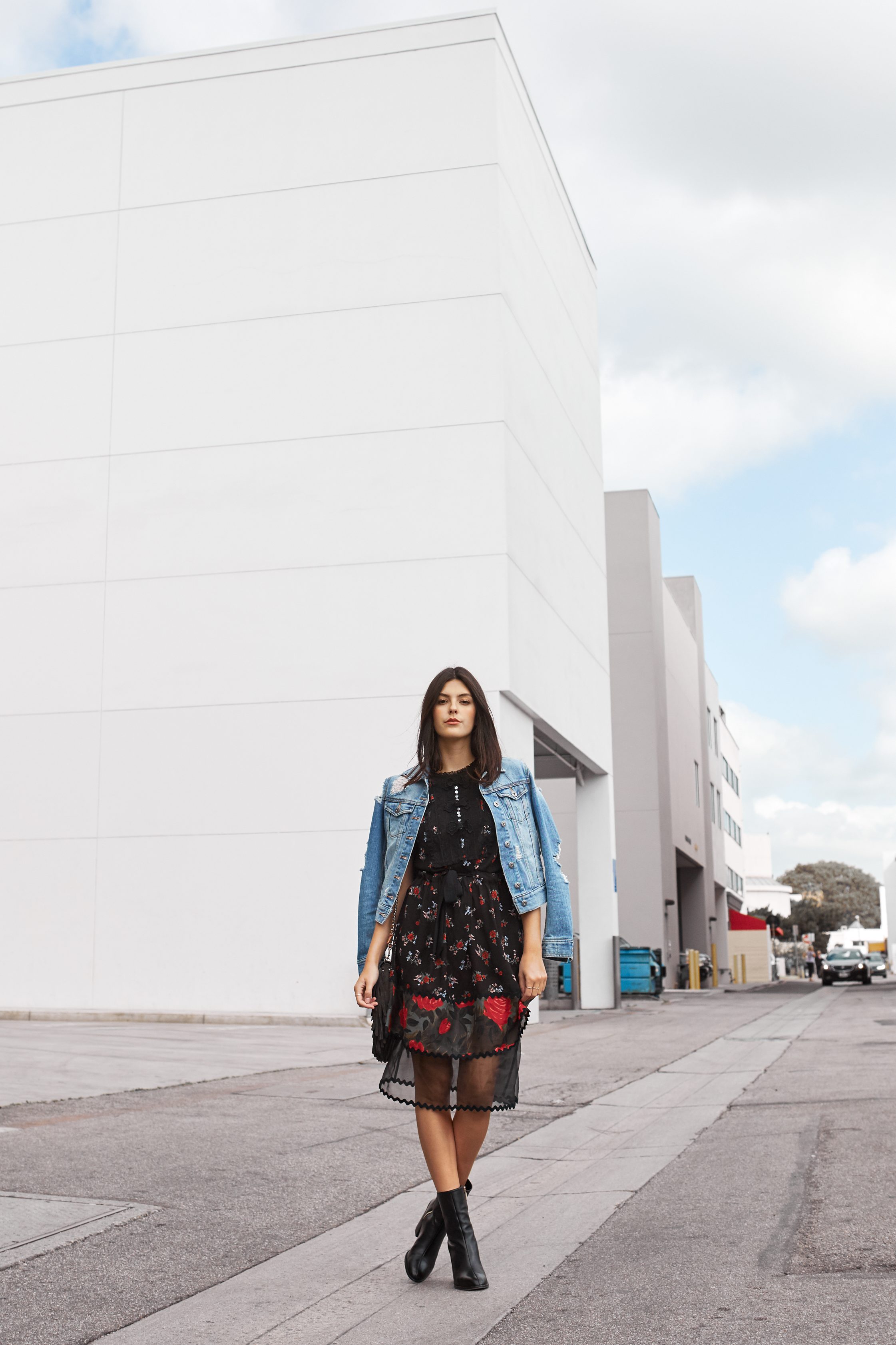 Julia Friedman makes florals look chic and edgy in Beverly Hills wearing a Coach Dress and Dear Francis boots.