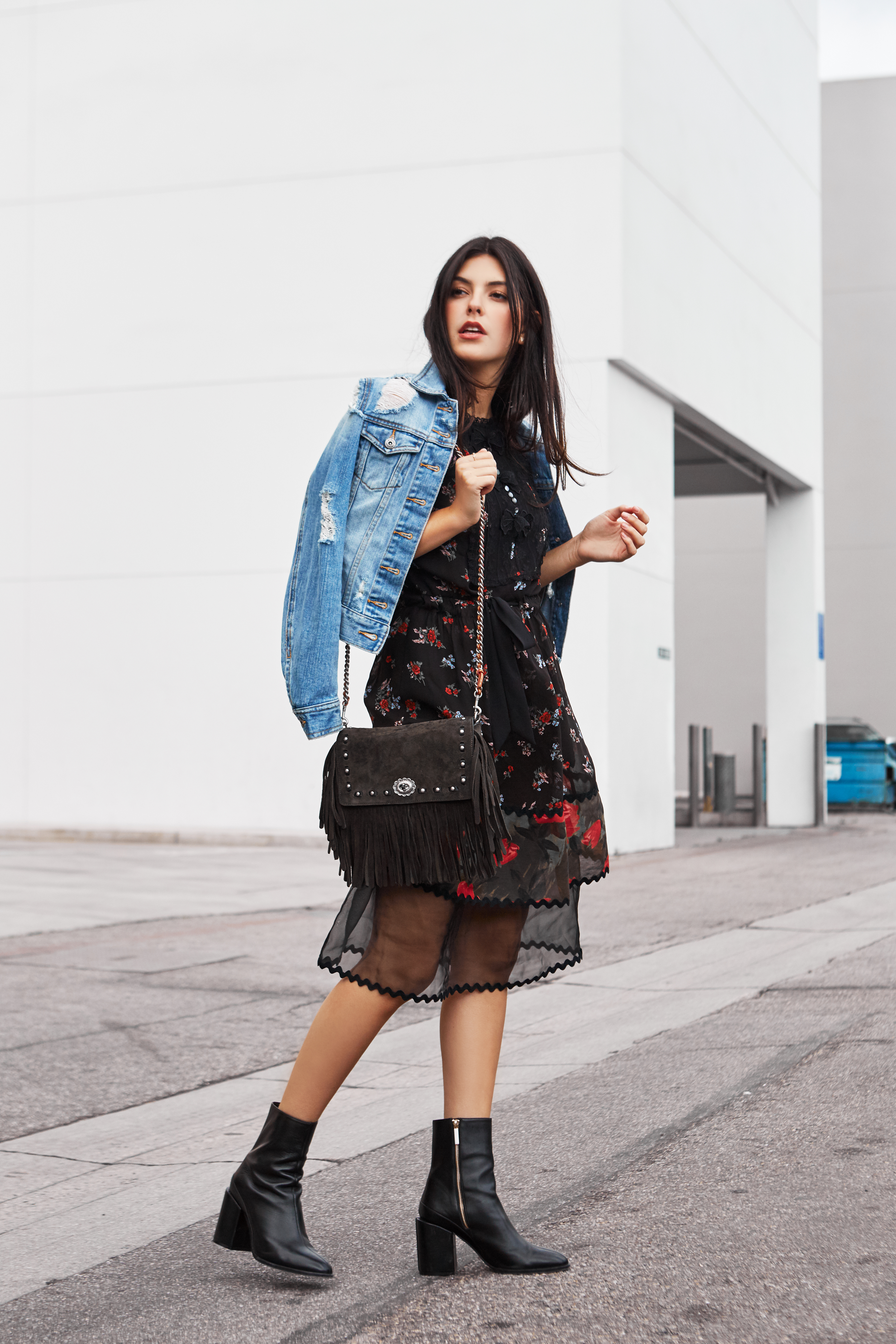 Julia Friedman makes florals look chic and edgy in Beverly Hills wearing a Coach Dress and Dear Francis boots.