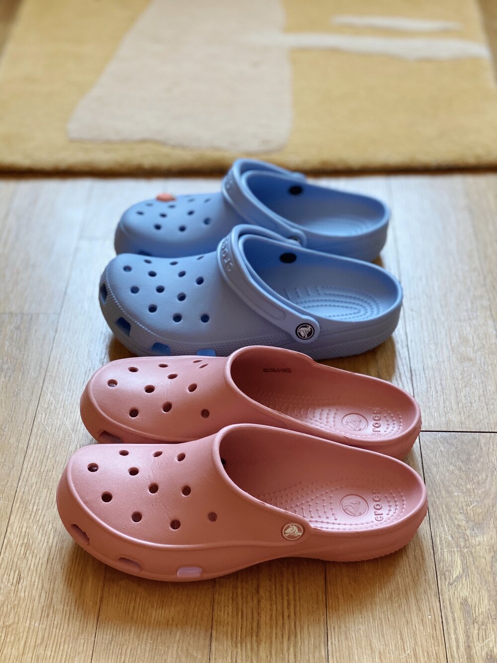 crocs with feet painted on them
