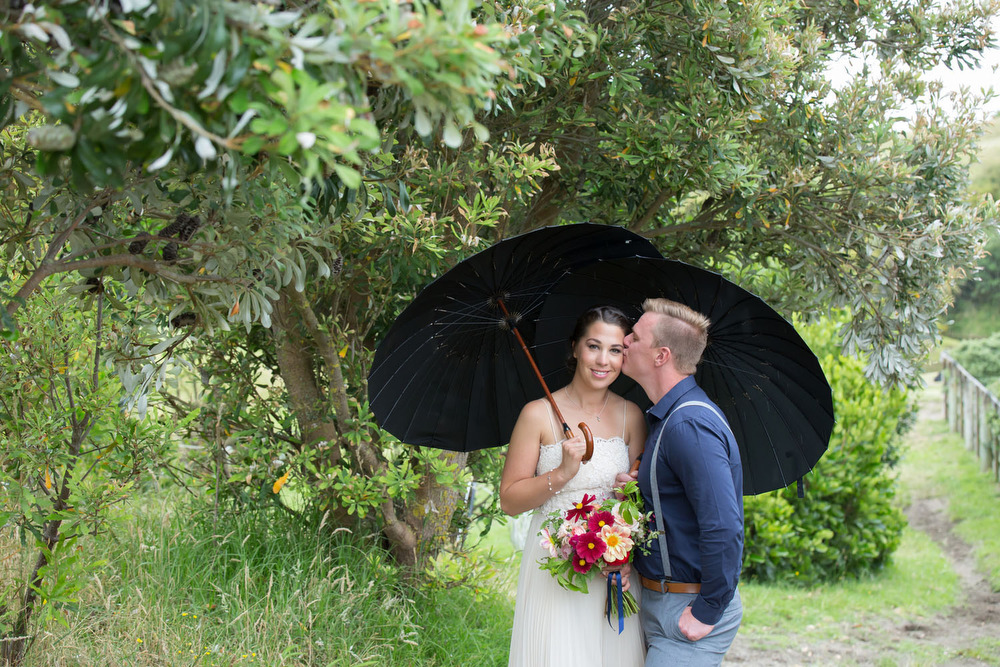 Rainy wedding photos on the Kapiti coast, Wellington. Photo by Jo Moore.