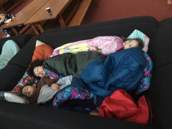 Homeless: The younger kids wanted to sleep indoors so I joined two couches together to make us a bed in Prindiville Hall