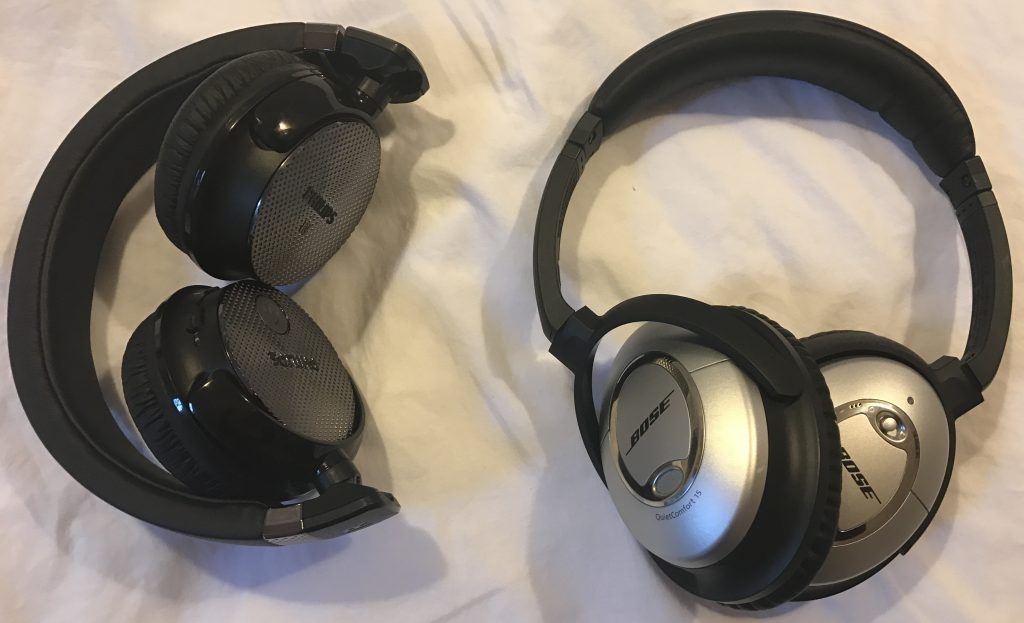 A side-by-side comparison of how small the Philips SHB8850NC headphones fold down to compared with the Bose QC15 headphones