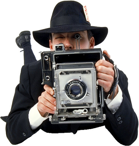 old fashioned camera being held by reporter on ground