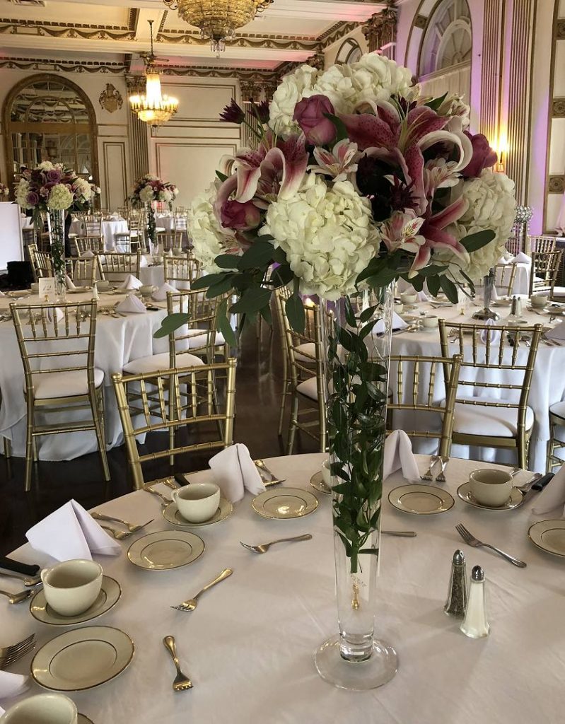 Tall centerpiece with Stargazer lilies and hydrangea