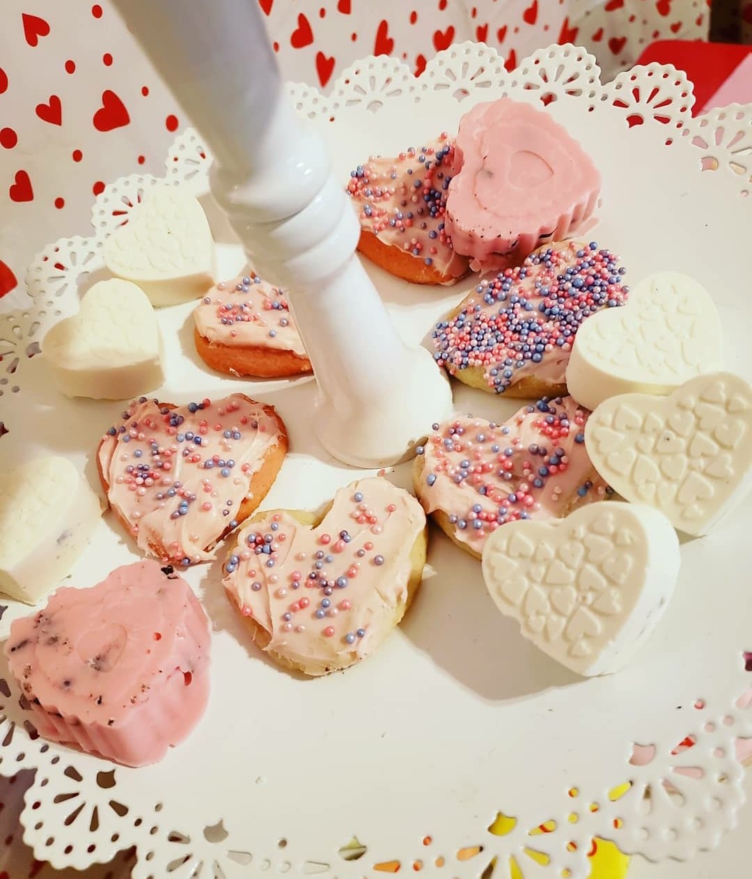 Chocolate Heart Candies and Heart Sugar Cookies with sprinkles on cake stand for Valentine's Day Party