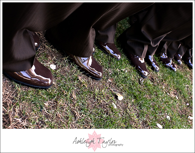 the groomsmen wore brown shoes to match their brown tuxes