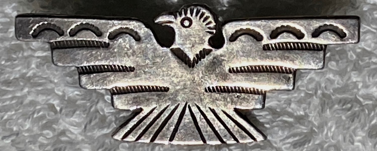 Fred Harvey era vintage Navajo Silver pin in a thunderbird shape 