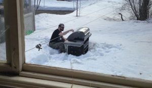 dude grilling in the snow