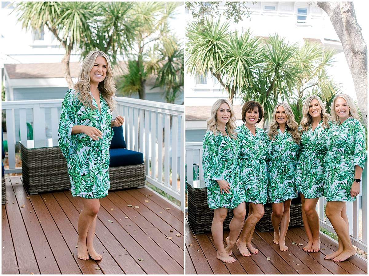 Gorgeous wedding at Presidio Yacht Club girls posing on porch in green tropical bathobes
