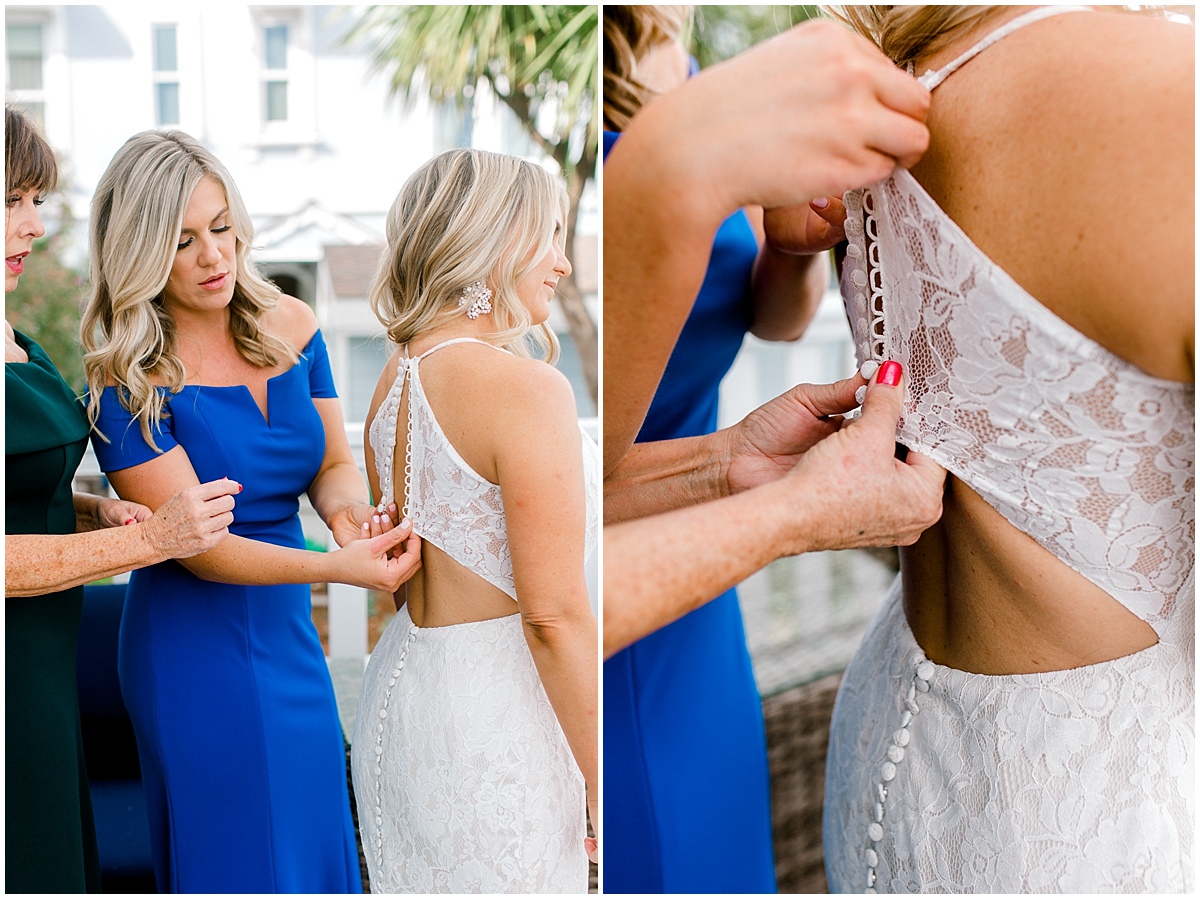 Gorgeous wedding at Presidio Yacht Club helping bride into her dress