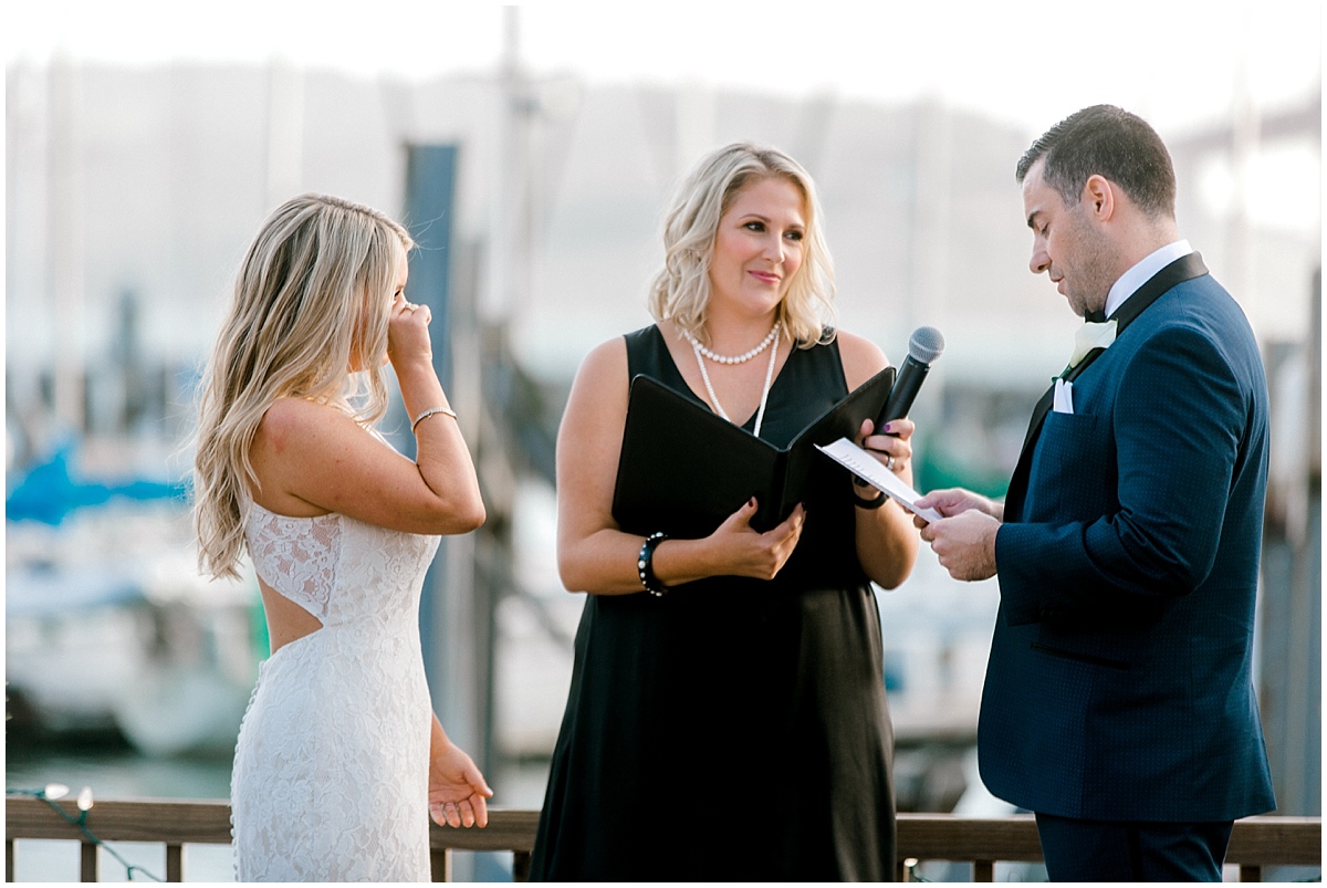 Gorgeous wedding at Presidio Yacht Club bride crying during vows