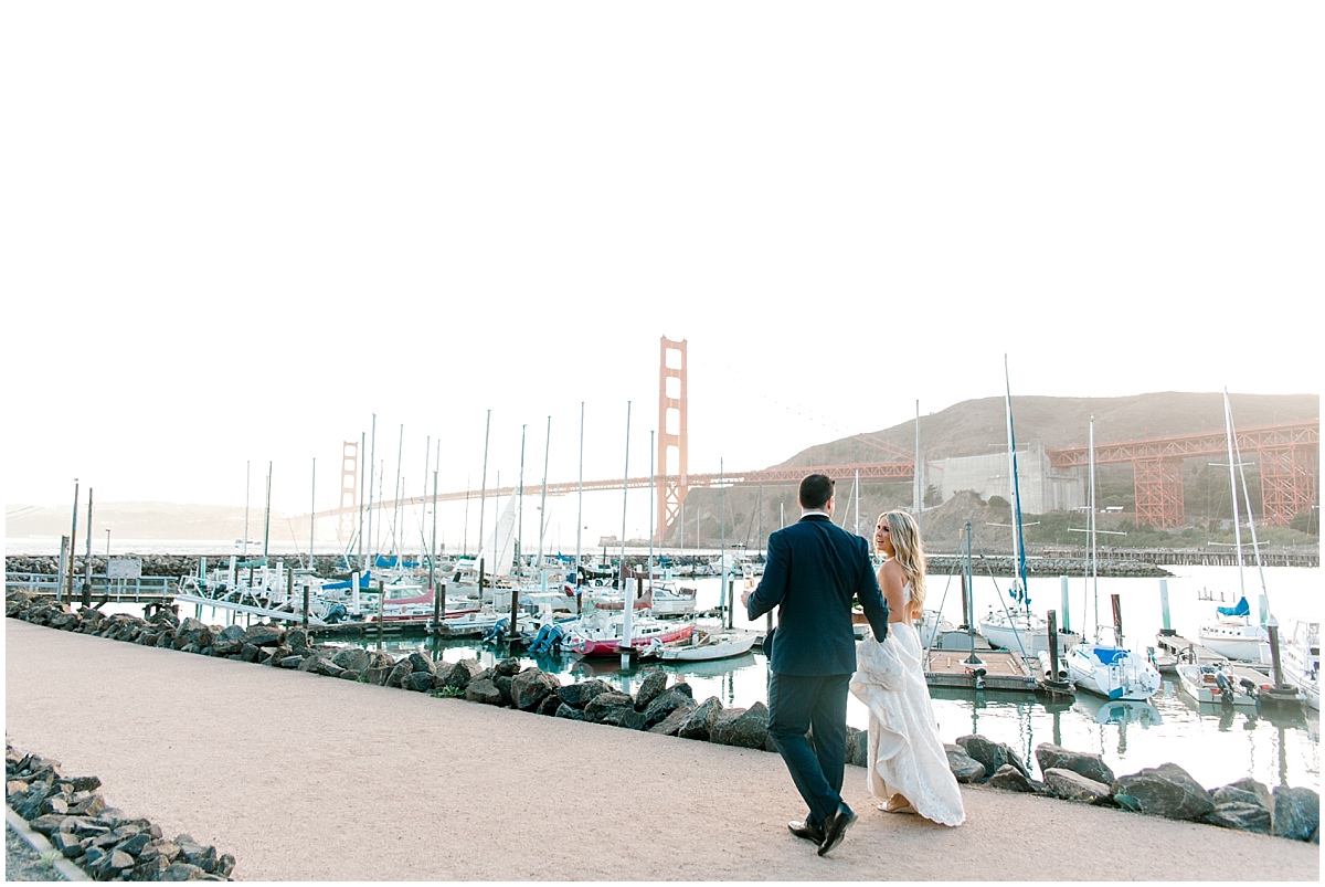 Gorgeous wedding at Presidio Yacht Club bride and groom sunset photos with boats at sunset