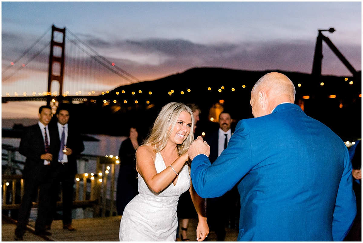 Gorgeous wedding at Presidio Yacht Club bride and her Dad dancing at sunset