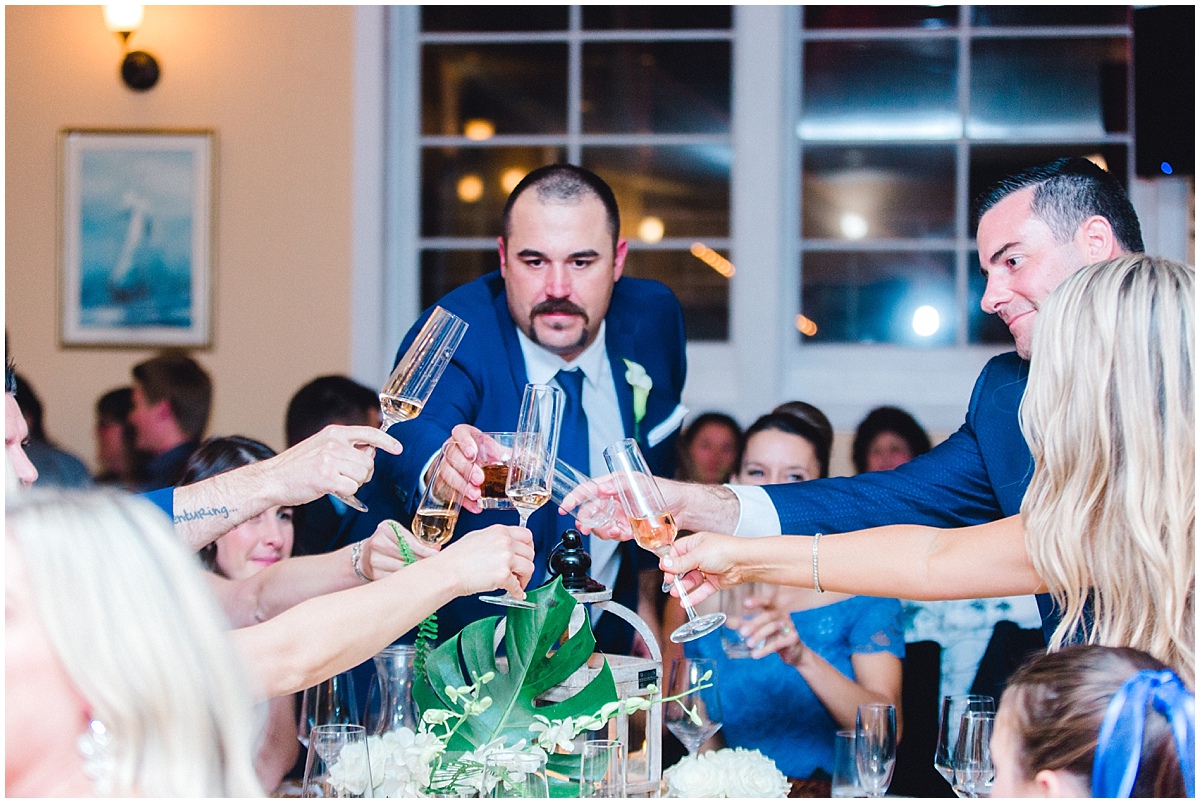 Gorgeous wedding at Presidio Yacht Club raising their glasses