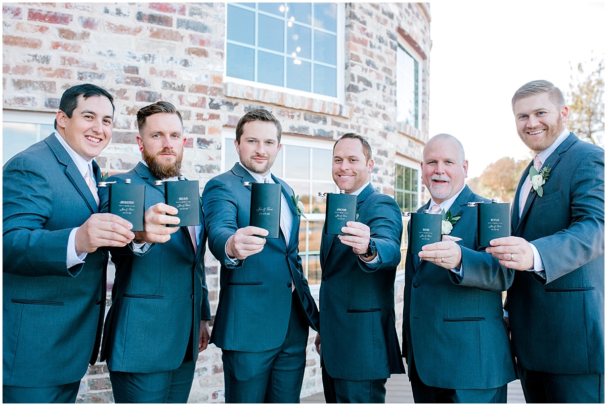Wedding at Rustic Grace Estate groomsmen and their personalized gifts