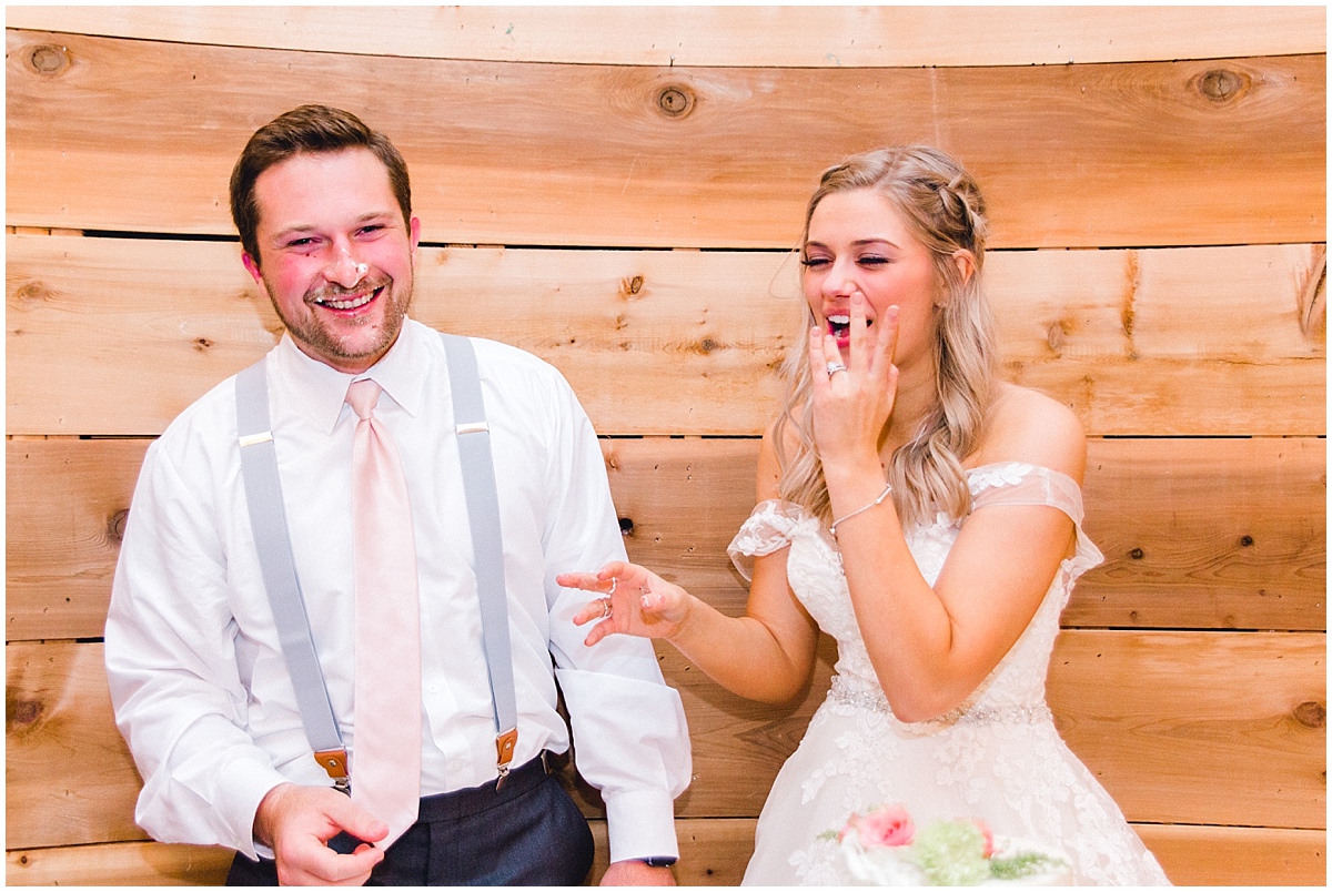 Wedding at Rustic Grace Estate face of bride and groom with cake smashed