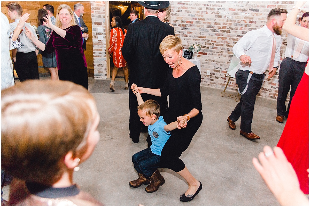 Wedding at Rustic Grace Estate Mom dancing with son at reception
