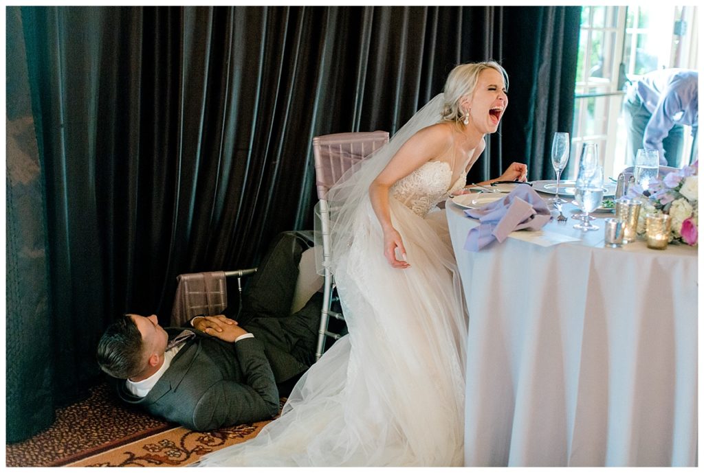 Spring Wedding at Vintners Inn bride laughing as groom falls out of his chair unexpectedley