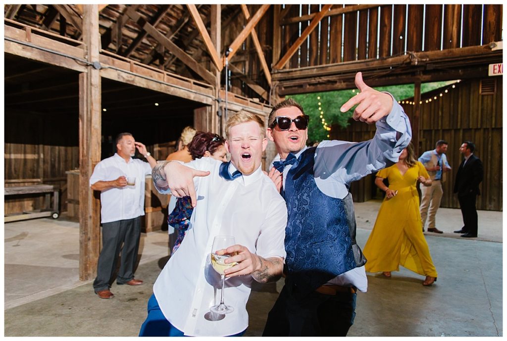 Wedding-at-Rus-Farm-groomsmen-being-silly-on-the-dance-floor