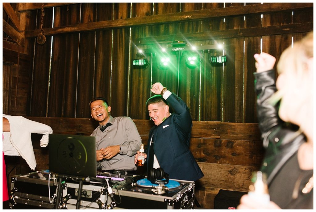 Wedding-at-Rus-Farm-groom-hanging-with-the-DJ