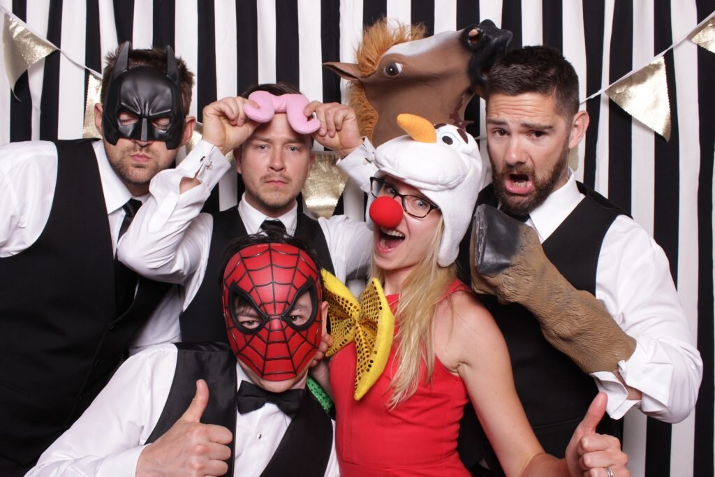 wedding guests pile into a photo booth rental in Calgary