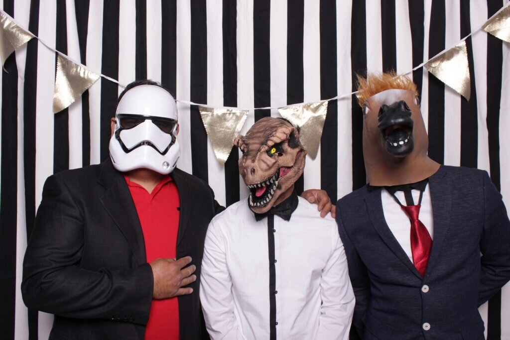 wedding guests rock some photo booth props