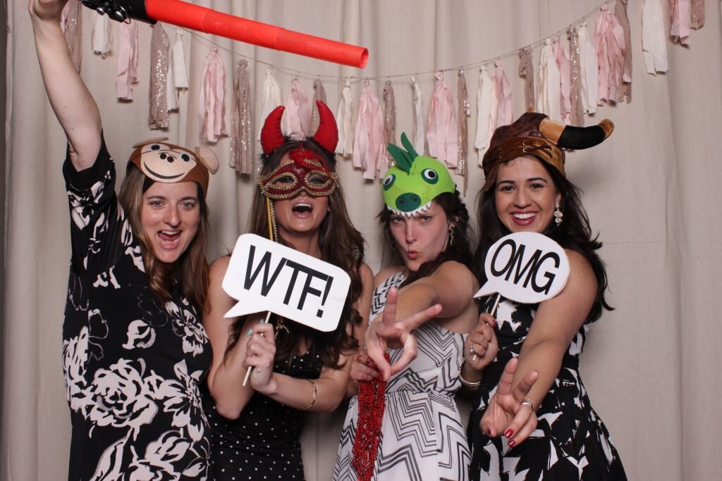 these girls are rocking a wedding reception photo booth