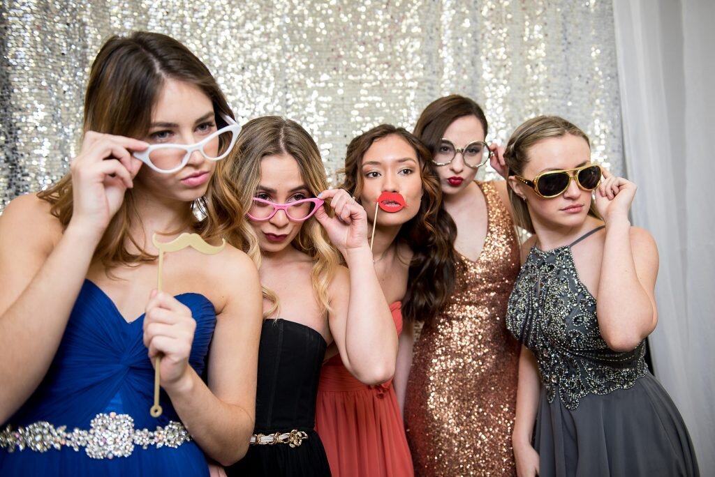 A group of girls enjoy their graduation and prom party