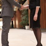 businesswoman and businessman handshake