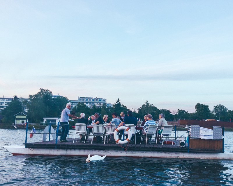 Group of friends on a boat on the Alte Donau