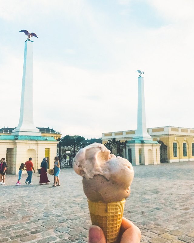 Ice cream held aloft outside Schonbrunn Palace gates