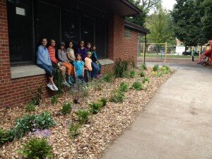 Girl Scout Troop 3032 in front of the new perennial garden at Center Street Park.