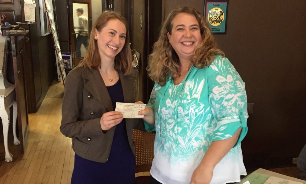 Tosa East senior Avery Pankratz (left) receives the annual $500 TETNA scholarship from association president Christina Piel at the annual meeting, held Thursday at Cranky Al's.