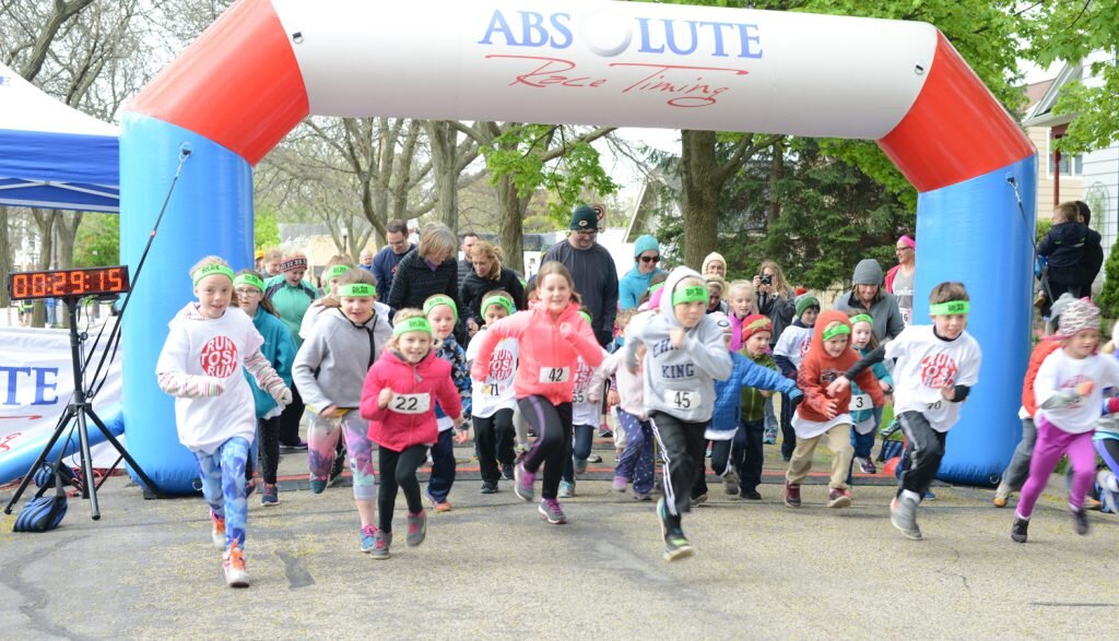 Children take off from the starting line of the Run Tosa Run kids’ run on Saturday, May 14. Photos by Mindy Mays.