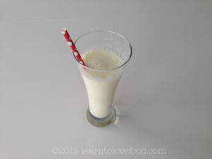 straw in a glass of milk