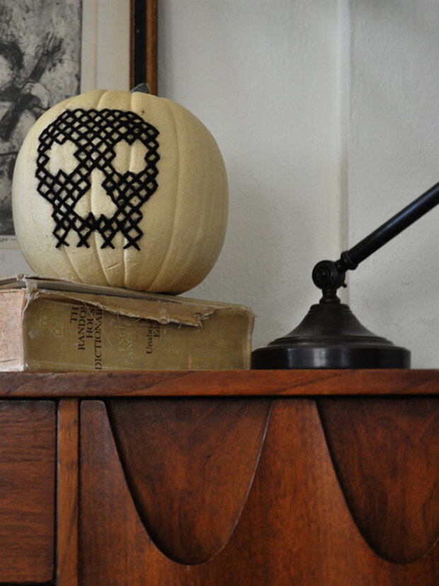 I'm not usually a skull person. but I like the cross stitch.