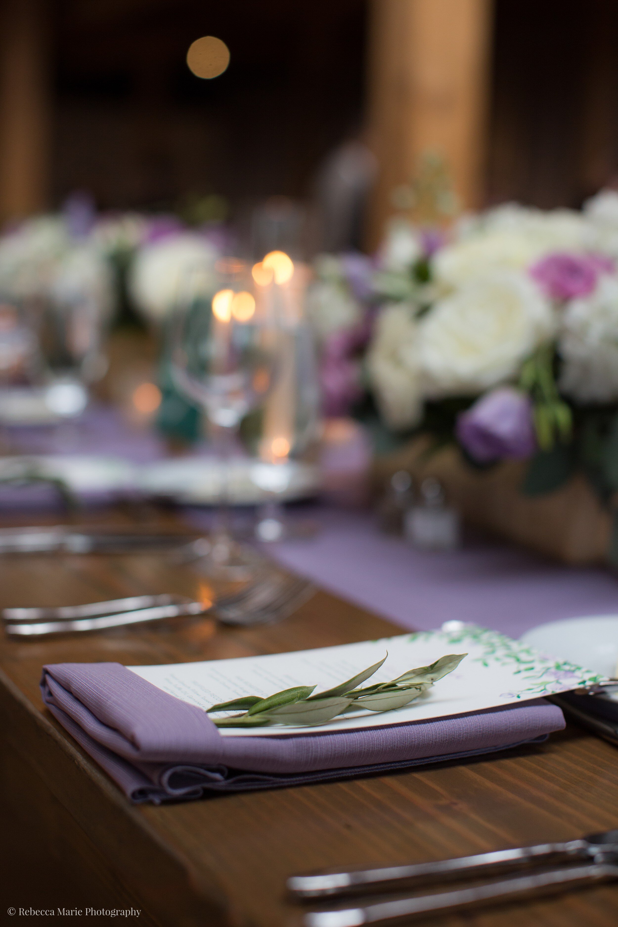 Purple napkins on wood table at wedding
