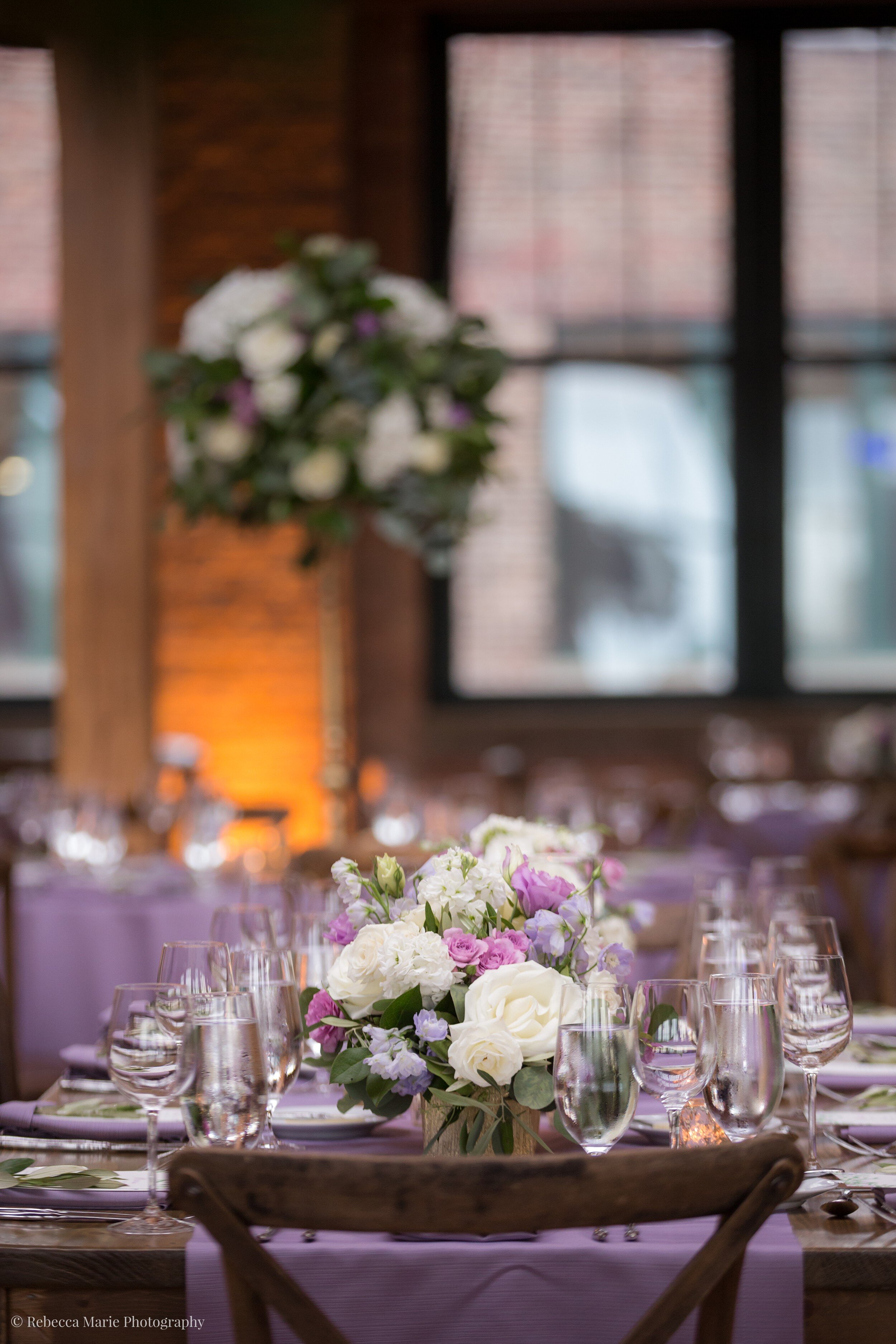 Wedding farm tables with purple flowers