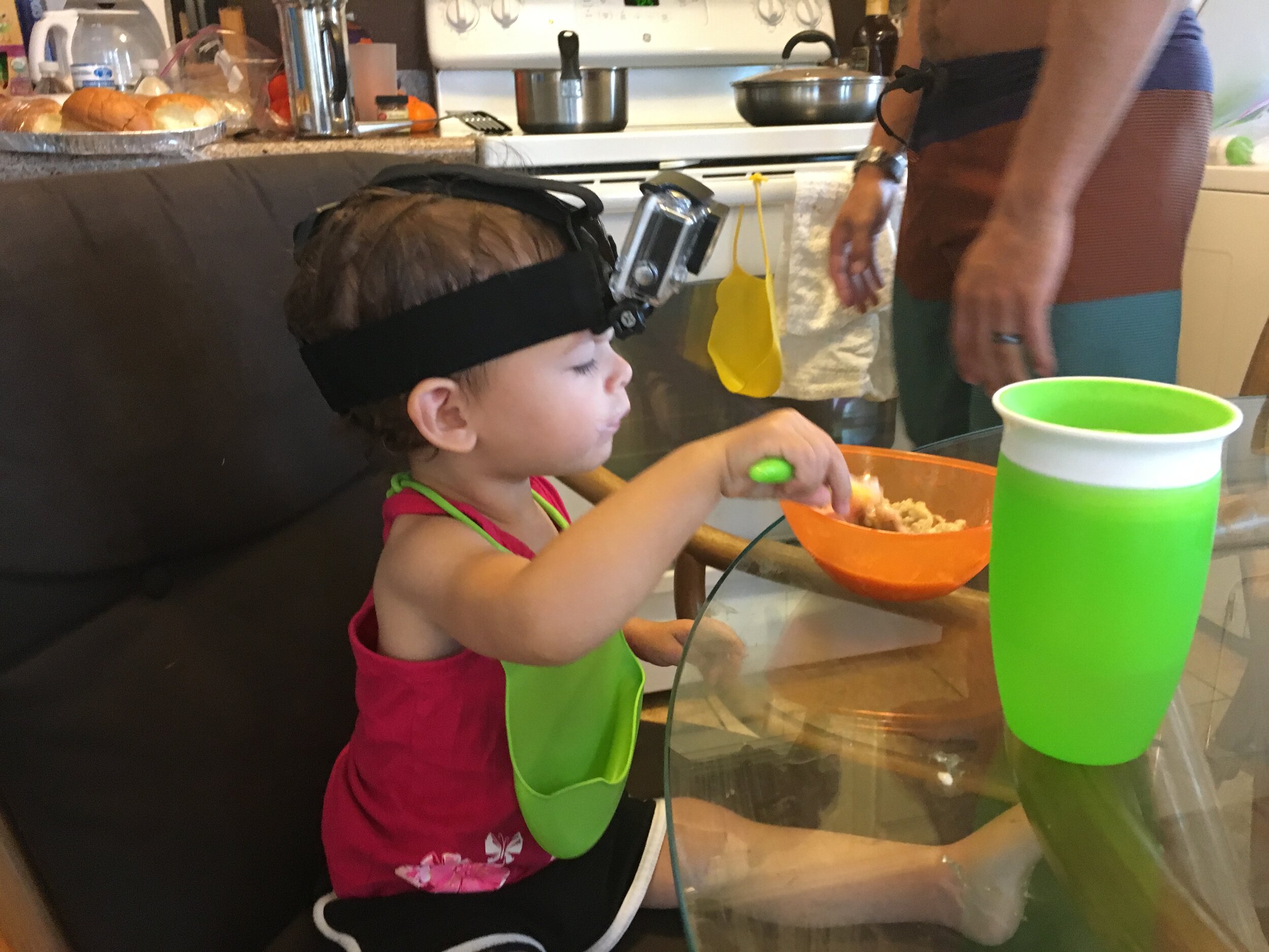 Genevieve eating breakfast. (She wanted to wear the go pro head mount. lol)