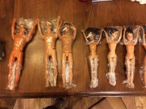 Covering Barbie legs with Plastic Wrap to make modest Barbies
