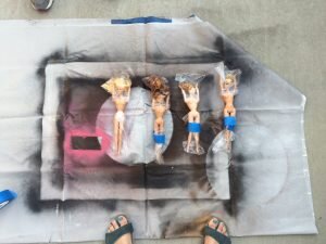 Spray Painting Barbies to make them modest