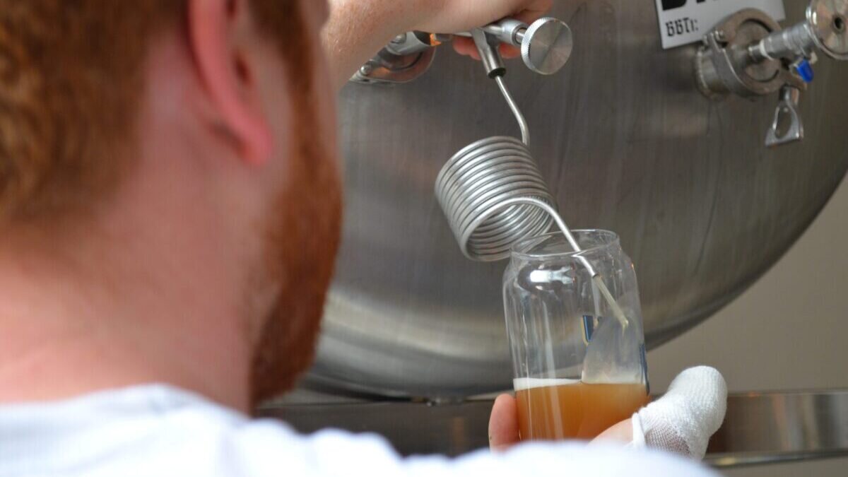 A picture of bar staff pouring beer straight from the tank at Broy tank bar