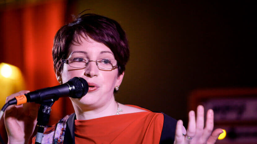 Abigail sings at launch of "Fall Into Silence" Photo by Paul McCarthy Photography
