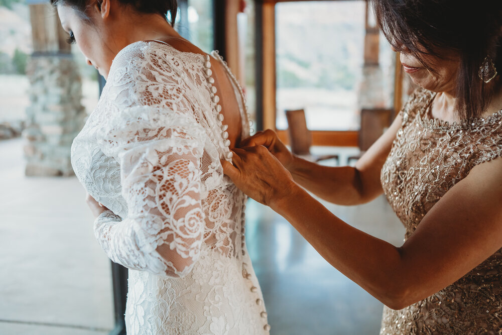  This beautiful lace wedding gown with intricate beading down the back require a little bit of help as she got ready to say “I do” #tealawardphotography #texasweddings #amarillophotographer #amarilloweddingphotographer #emotionalphotography #intimateweddingphotography #weddingday #weddingphotos #texasphotographer #inspiredwedding #intimatewedding #weddingformals #bigday #portraits 