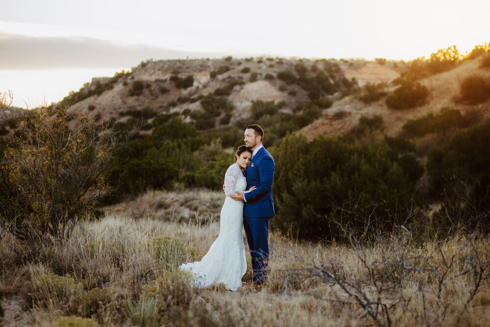  The white of the brides dress and the navy blue suit worn by the groom looked wonderful against the Canyon backdrop on their wedding day #tealawardphotography #texasweddings #amarillophotographer #amarilloweddingphotographer #emotionalphotography #intimateweddingphotography #weddingday #weddingphotos #texasphotographer #inspiredwedding #intimatewedding #weddingformals #bigday #portraits 