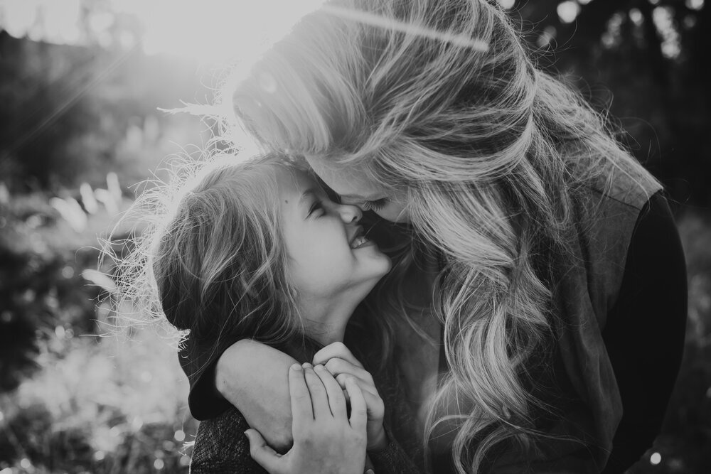  Black and white photo of tender moment between mother and daughter #tealawardphotography #texasfamilyphotographer #amarillophotographer #amarillofamilyphotographer #lifestylephotography #emotionalphotography #familyphotoshoot #family #lovingsiblings #purejoy #familyphotos #naturalfamilyinteraction 